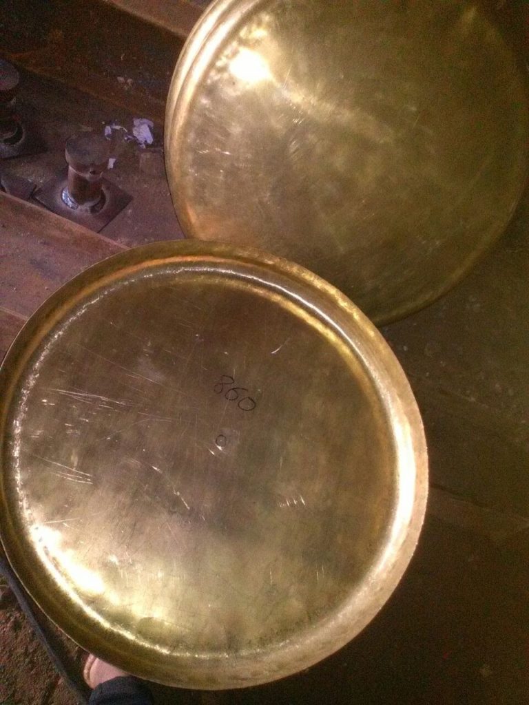 Dished ends of brass material